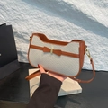 Chic woven underarm bag in creamy white with brown leather trim and bow detail - White