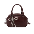 Retro dark red bowling handbag with glossy finish and pearl bow charm - Burgundy