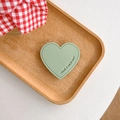 Detail of mint green heart leather phone socket with Have a Nice Day text and stitching - Green