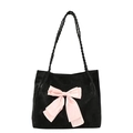 Sweet black velvet tote bag featuring a large pink bow and woven handles for casual style - Black