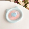 Close-up of light blue heart-shaped phone clip with pink bow on bear tray - Crystal Bowknot Heart - Blue