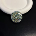 Macro shot of circular heart-shaped grip tok with colorful glitter and sequins - Black Round