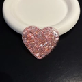 Macro shot of pink glitter heart resin socket for mobile phone grip and stand - Red Heart