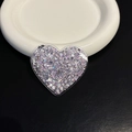 Detail showing a heart-shaped glitter phone socket with sparkling sequins on leather - Purple Heart