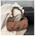 Detail view of the brown corduroy shoulder bag with pleated handle and metal logo - Brown