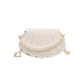 White shell-shaped shoulder bag with pearl accents and thin golden chain strap - White