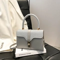 Borsa a mano scintillante con patta glitter argento e chiusura a girello dorata - Argento