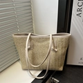 Minimalist beige woven straw tote bag with knotted shoulder strap for summer vacation style - White