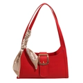 Red crocodile pattern shoulder bag with golden buckle and silk scarf on white backdrop - Red