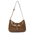 Classic dark brown patent leather hobo bag with a distinctive golden metal clasp closure - Brown
