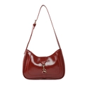 Glossy burgundy patent leather underarm bag with gold metallic buckle on white background - Red