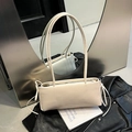 Elegant cream-colored minimalist underarm shoulder bag with slim long straps for women - White