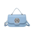 Light blue letter M handbag with gold buckle and adjustable strap on white background - Blue