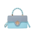Elegant blue patchwork handbag with floral metal clasp and twisted top handle design - Blue