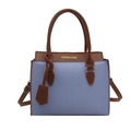 Chic color-block handbag in blue and brown pebbled leather with top handles and strap - Blue