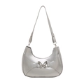 Silver crescent underarm bag with metallic finish and center metal butterfly ornament - Silver
