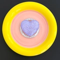 Macro shot of purple heart bath bomb with crystalline texture on Gift For You tray - Magnetic Gift Style - Purple