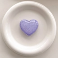 Detailed top view of a sparkling purple heart-shaped glitter phone grip on a white tray - 3D Airbag Style - Purple