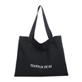 Large black canvas tote bag featuring white letter print and durable shoulder straps - Black