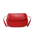 Sleek red saddle crossbody bag for women with polished finish and minimalist flap design - Red