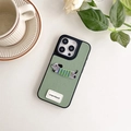 Detail of grey-green leather iPhone case featuring embroidered dachshund and goodluck tag - Green / iPhone 16e