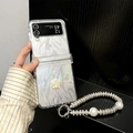 Detail of luxury silver marble phone case with 3D white rose and rhinestone pearl strap - Gold-Edged Rose (Feather Paper + Pearl Chain) / Samsung ZFlip3
