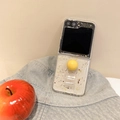 Close-up of glitter phone case for Galaxy Z Flip with yellow sphere stand on denim hat - Matte Hard Case-Silver Foil Heart-Ball Ring-Yellow / Samsung ZFold3