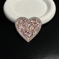 Close-up of heart-shaped phone grip with sparkling sequins and diamond-studded edges - Pink Purple Gold Sparkling Sequins (No. 6)