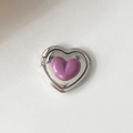 Close-up of a silver metal heart-shaped phone ring holder with a purple resin center - Purple