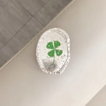 Detail of silver foil flower oval metal phone stand with lucky clover and hammered edge - Oval Real Flower-Silver Foil Four-Leaf Clover