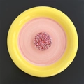 Detail of round phone socket featuring sparkling red and pink glitter inside clear resin - Round / Red