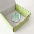 Macro view of mint green butterfly phone stand with silver edges in a premium box - Cloud Flash Butterfly Blue