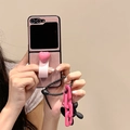 Pink lychee texture folding phone case with heart stand, handle, and black balloon dog charm - Black Heart Ring Style (Includes Card Puppy Chain Pendant) / Samsung ZFlip3