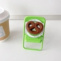 Detailed view of creative pretzel-shaped phone grip on a clear 'Gift For You' base - Chocolate Heart/Pretzel (Gift Magnetic)
