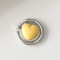 Detail view of a 3D yellow heart phone ring holder with a polished silver metallic base - Fat Heart / Yellow