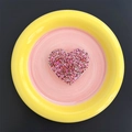 Top view of a heart-shaped phone grip with vibrant pink and silver glitter inside - Heart / Red