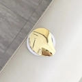 Close-up of liquid-effect metallic heart phone holder with polished gold plating finish - Metallic Waterdrop / Gold