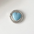 Macro detail of foldable silver heart ring phone holder with blue enamel finish - Fat Heart / Blue