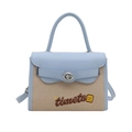 Bolso de cuero azul y lona beige con correa ajustable y cierre giratorio de metal - Azul