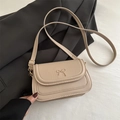 Elegant minimalist beige crossbody bag with golden bow detail and adjustable strap - Khaki