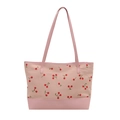 Canvas cherry print tote bag with pink leather trim and long handles on white background - Pink