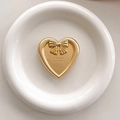 Detail of a matte gold heart phone grip with a bow accent and happy engraving - Transparent Pop-up Stand - Gold Heart Bow