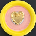 Detail of a golden heart phone stand with 3D bow and happy text on a pink ceramic tray - Magnetic Stand - Gold Heart Bow