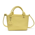 Fashionable pale yellow PU leather handbag with circular ring handles and smiley charm - Yellow