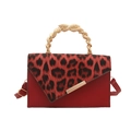 Red leopard print shoulder bag with a unique gold metal spiral top handle and leather strap - Red