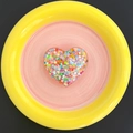 Detail shot of heart-shaped glitter phone socket with colorful sequins inside a resin shell - Candy Heart - Multi-color