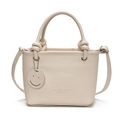 Chic beige lychee grain PU handbag with adjustable strap and smiley face tag charm - Off White