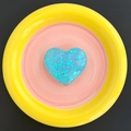 Detail of blue glitter heart phone socket holder on a pink and yellow ceramic dish - Candy Heart - Blue