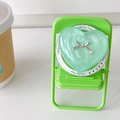 Close-up of mint green heart phone socket with silver bow on a mini green chair - Pearl Green