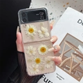 Detailed macro view of real dried daisy flowers and glitter embedded in a clear phone case - Matte Hard Shell Style - Sunflower / Samsung ZFold3